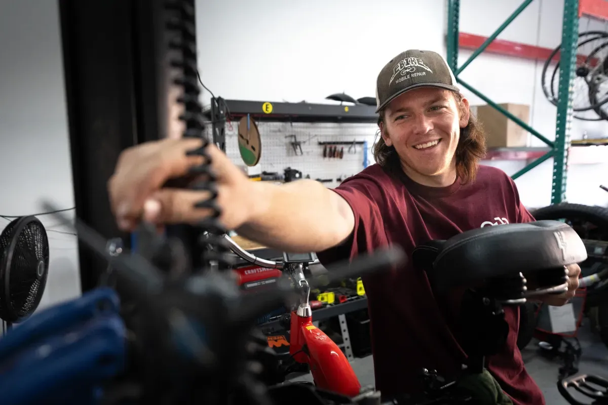 Chase working on an e-bike